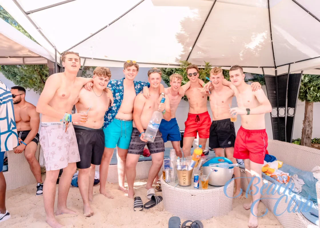 Group of mates partying in the sun at Albufeira Pool Party with drinks, vibes and summer beats at Heaven Beach Club.