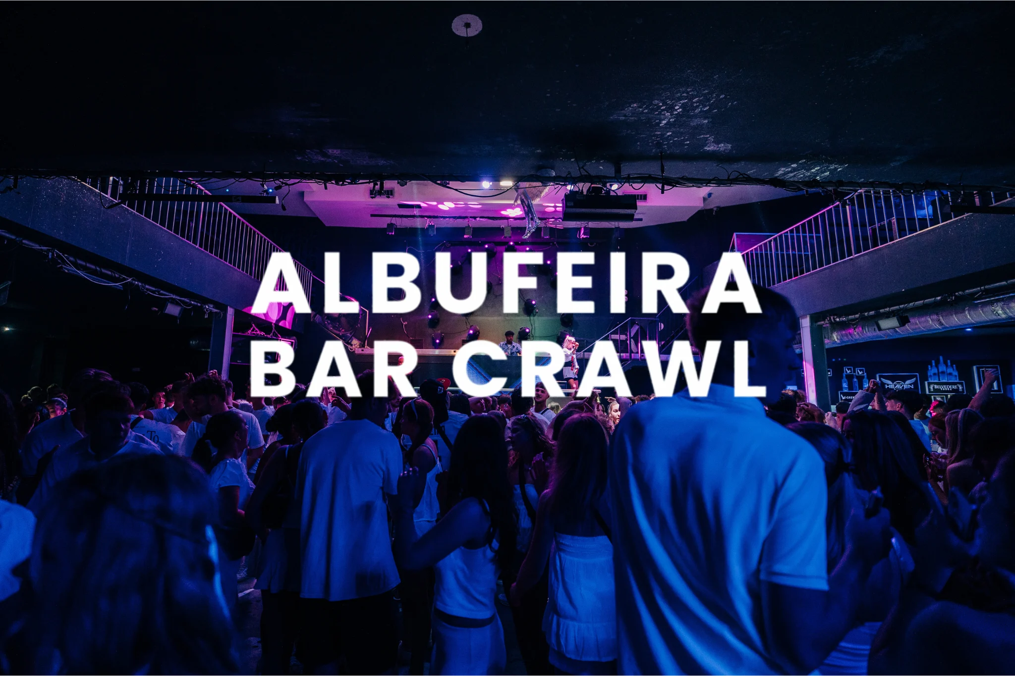 Crowds dressed in white at the Albufeira Bar Crawl — non-stop tunes, packed dancefloors.
