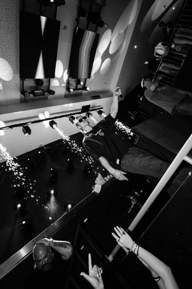 Performer lights up the stage at Club Heaven Albufeira as fireworks burst and the crowd goes wild.