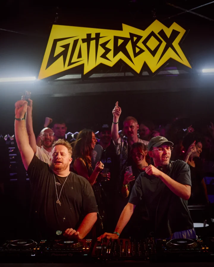 DJs performing at Glitterbox in Ibiza with the crowd going wild, pure house beats and electric party energy.